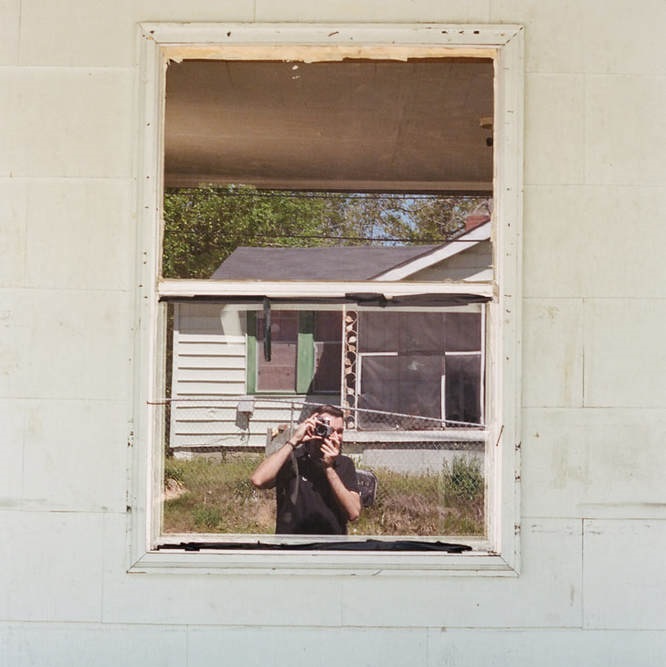 Self Portrait in Window of Home in Alabama